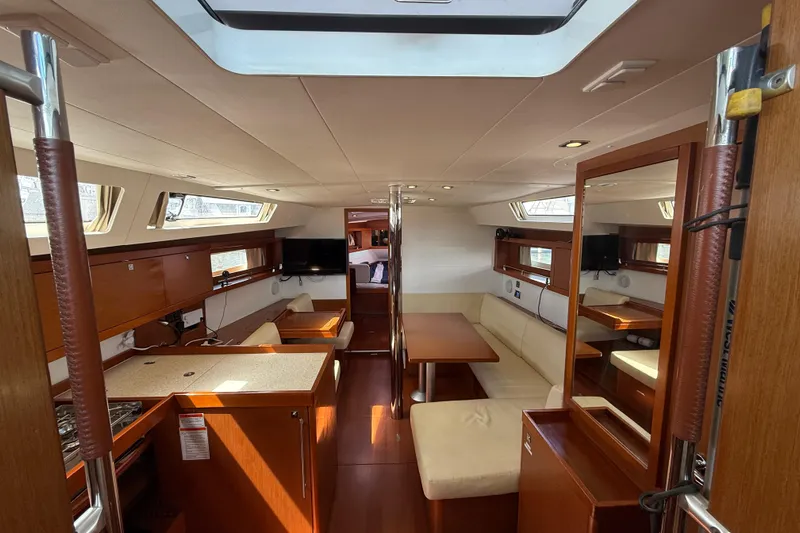 Wind Waker Yacht Photos Pics Interior of 2013 Beneteau Oceanis 41 yacht, featuring elegant wood finishes and spacious seating.