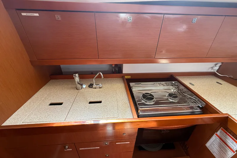 Wind Waker Yacht Photos Pics Galley kitchen in 2013 Beneteau Oceanis 41 yacht with stove and sink.