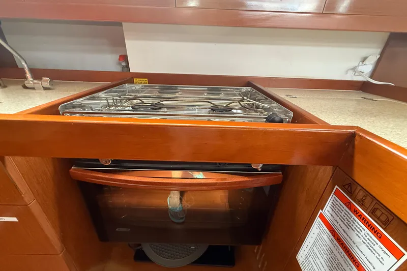 Wind Waker Yacht Photos Pics Galley kitchen in 2013 Beneteau Oceanis 41 sailboat with stove and oven.