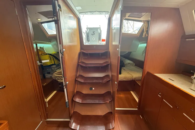 Wind Waker Yacht Photos Pics Interior of 2013 Beneteau Oceanis 41 sailboat with wooden stairs and cozy cabins.