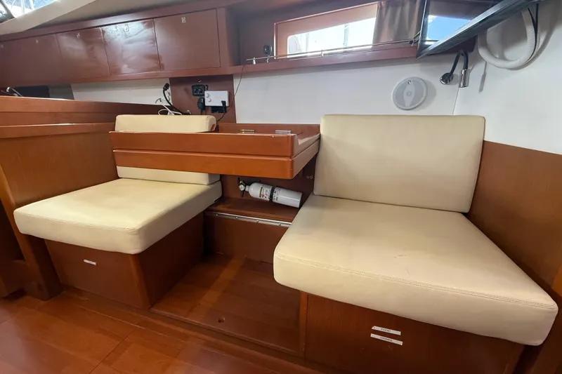 Wind Waker Yacht Photos Pics Interior of 2013 Beneteau Oceanis 41 yacht with beige seating and wooden finish.
