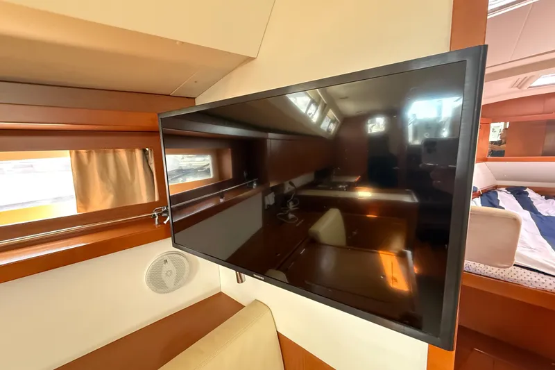 Wind Waker Yacht Photos Pics Interior of 2013 Beneteau Oceanis 41 yacht with mounted flat-screen TV.