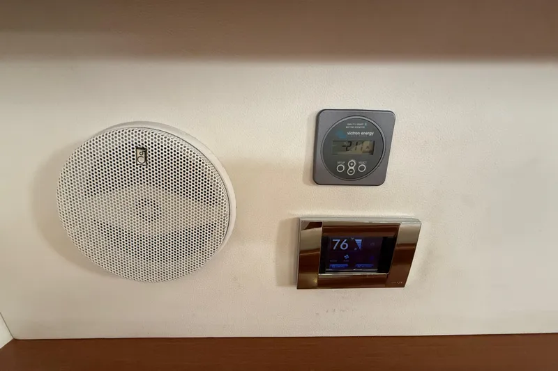 Wind Waker Yacht Photos Pics Interior controls of a 2013 Beneteau Oceanis 41 yacht, featuring a speaker and digital displays.