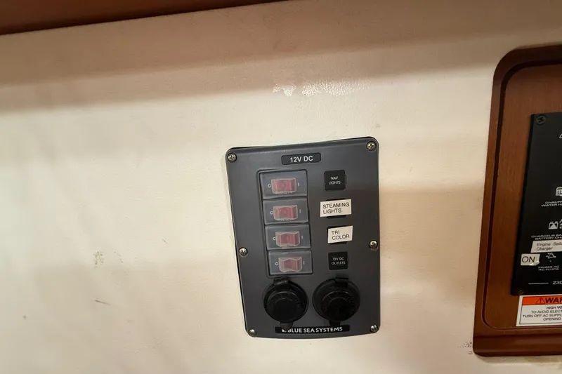 Wind Waker Yacht Photos Pics Control panel on a 2013 Beneteau Oceanis 41 sailboat, featuring 12V DC switches.