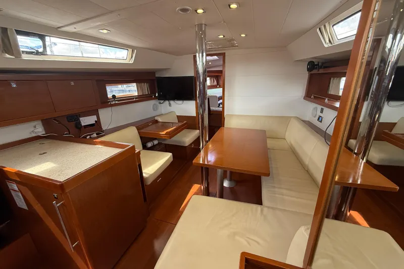 Wind Waker Yacht Photos Pics Interior of 2013 Beneteau Oceanis 41 yacht with modern seating and dining area.