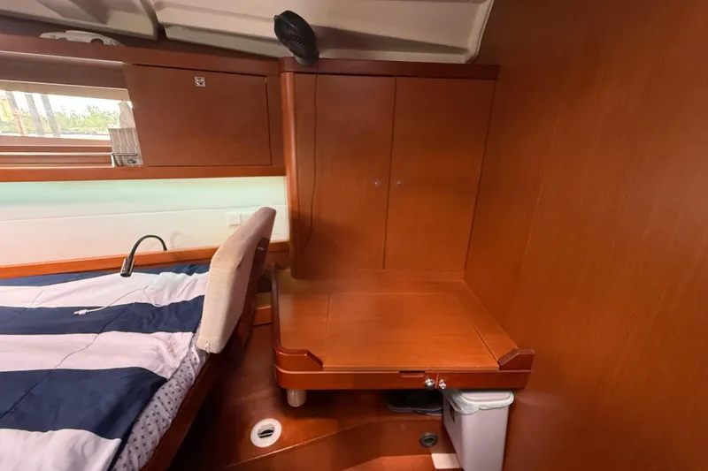 Wind Waker Yacht Photos Pics Interior cabin of 2013 Beneteau Oceanis 41 yacht with wooden cabinetry and bed.