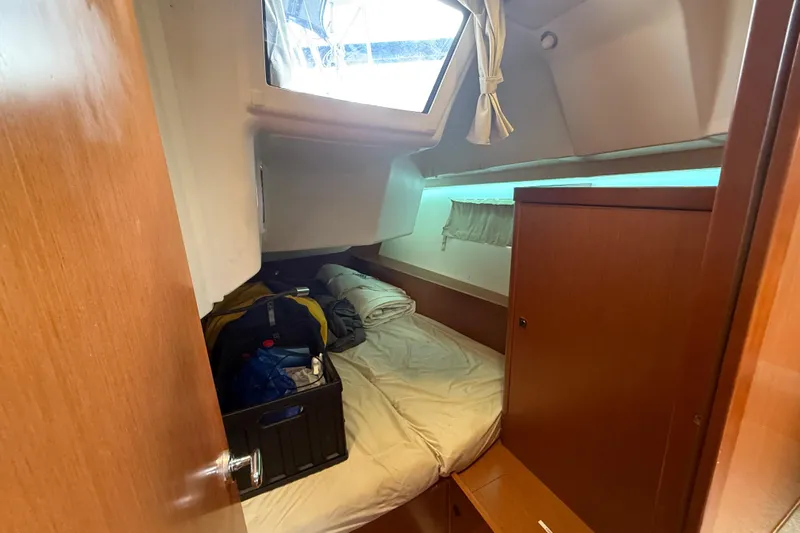 Wind Waker Yacht Photos Pics Cozy cabin interior of 2013 Beneteau Oceanis 41 sailboat with bed and storage.