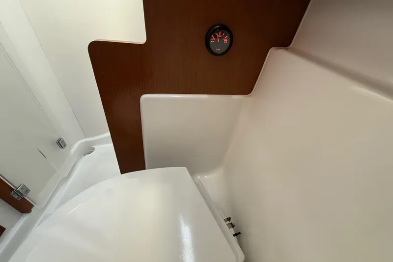 Wind Waker Yacht Photos Pics Interior of 2013 Beneteau Oceanis 41 yacht bathroom with wood paneling and gauge.