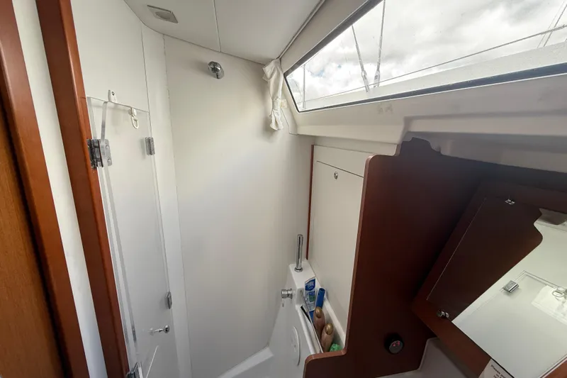 Wind Waker Yacht Photos Pics Interior of 2013 Beneteau Oceanis 41 yacht bathroom with shower and mirror.