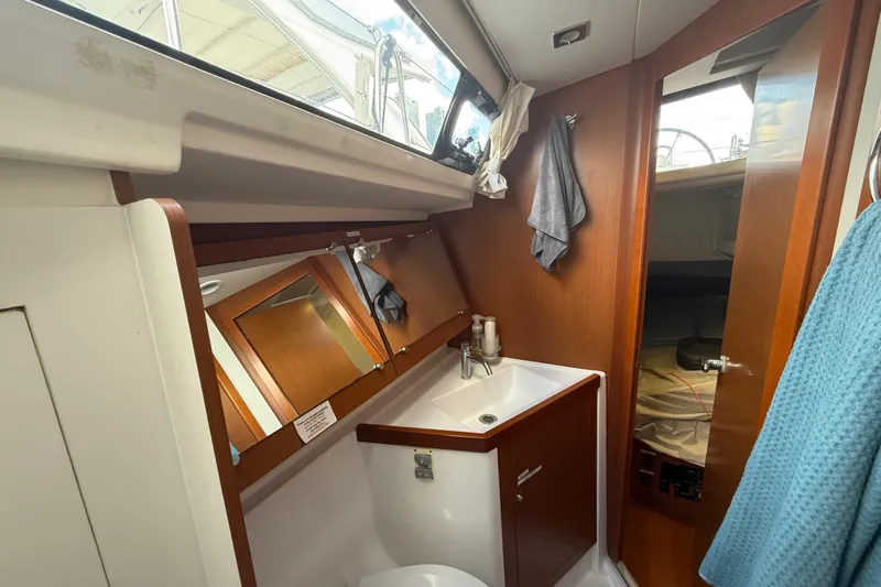 Wind Waker Yacht Photos Pics Interior of 2013 Beneteau Oceanis 41 yacht bathroom with sink and mirror.