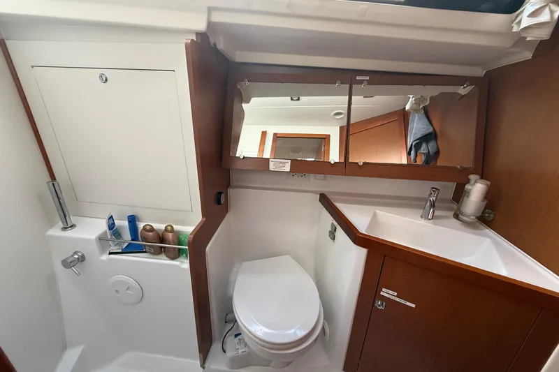 Wind Waker Yacht Photos Pics Bathroom of 2013 Beneteau Oceanis 41 yacht with sink, toilet, and mirror cabinet.