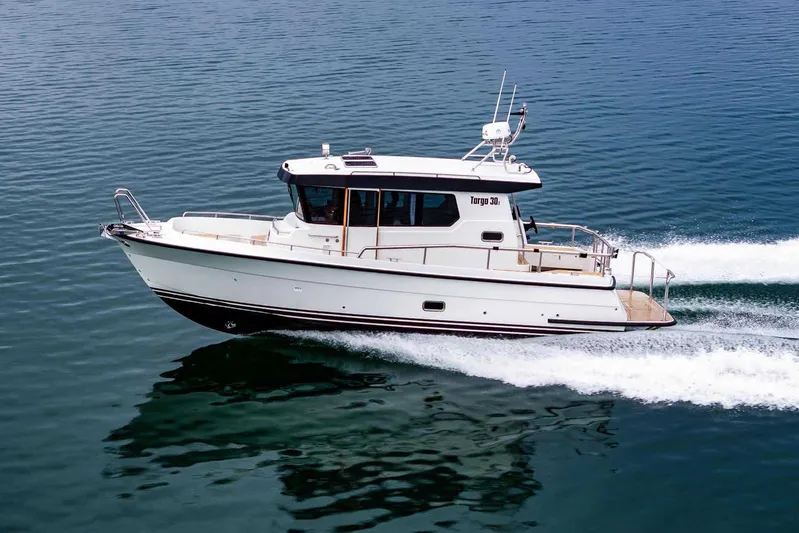  Yacht Photos Pics 2024 Targa 30.1 boat cruising on calm blue water.