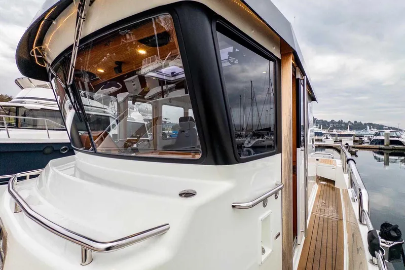  Yacht Photos Pics 2024 Targa 30.1 boat docked at marina, showcasing sleek design and modern features.