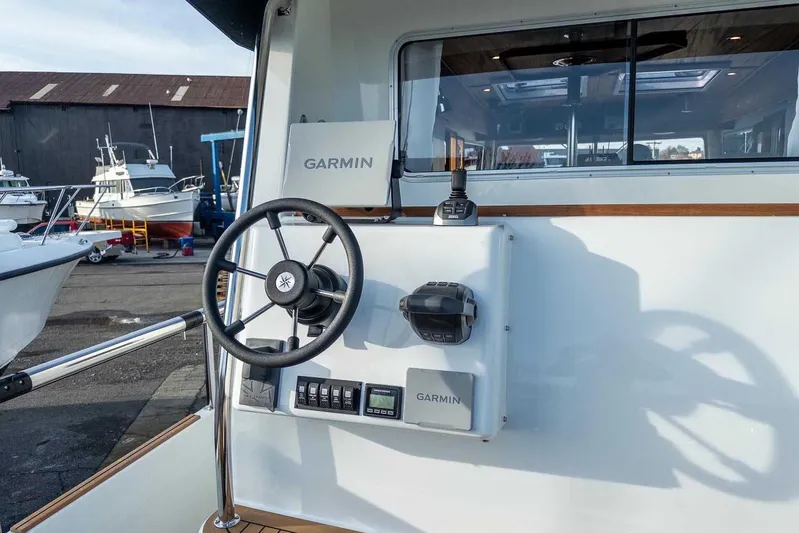  Yacht Photos Pics 2024 Targa 30.1 boat helm with Garmin navigation system and steering wheel.