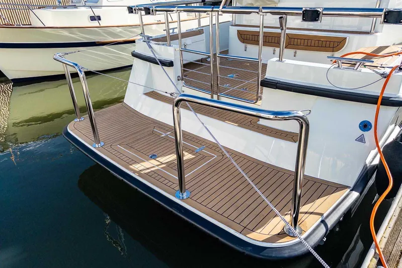  Yacht Photos Pics 2024 Targa 30.1 yacht with sleek deck design and stainless steel railings.