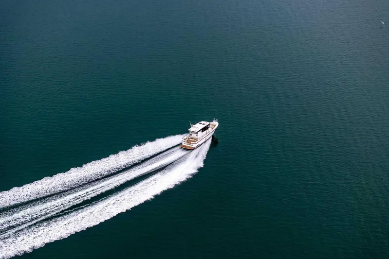  Yacht Photos Pics 2024 Targa 30.1 boat cruising on open water, leaving a wake trail.