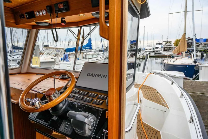  Yacht Photos Pics 2024 Targa 30.1 boat cockpit with Garmin navigation, docked at marina.