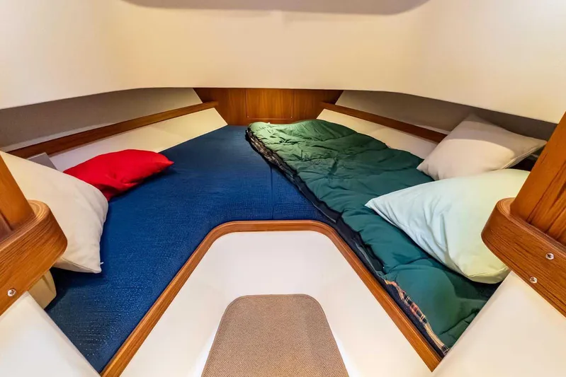  Yacht Photos Pics Cozy cabin interior of 2024 Targa 30.1 boat with colorful bedding.