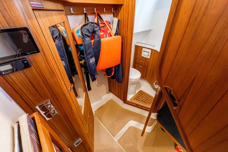  Yacht Photos Pics 2024 Targa 30.1 yacht interior with wooden finish and life jackets.