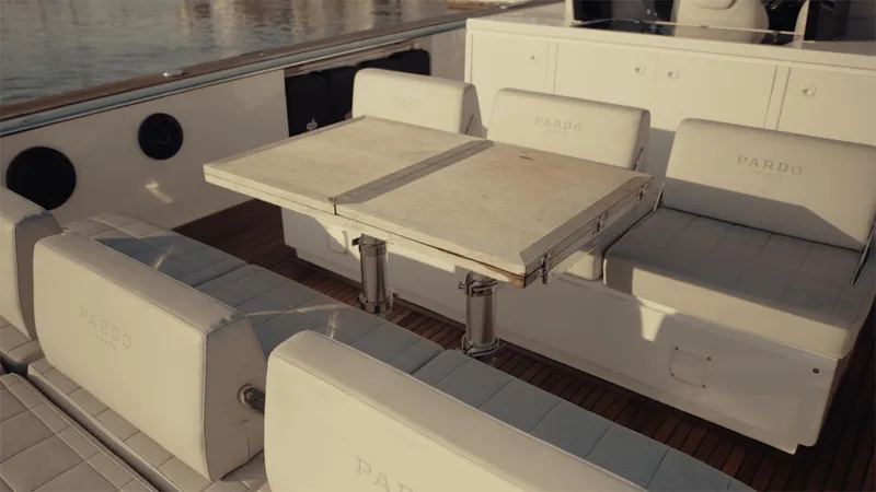 Mea Yacht Photos Pics Luxury seating area on 2022 Pardo Yachts 43, featuring elegant white upholstery and a central table.