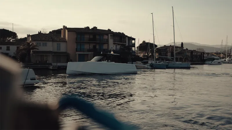 Mea Yacht Photos Pics 2022 Pardo Yachts 43 cruising near waterfront homes at sunset.