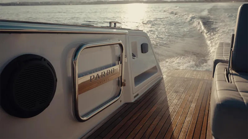 Mea Yacht Photos Pics Pardo Yachts 43, 2022 model, cruising on water with elegant wooden deck.