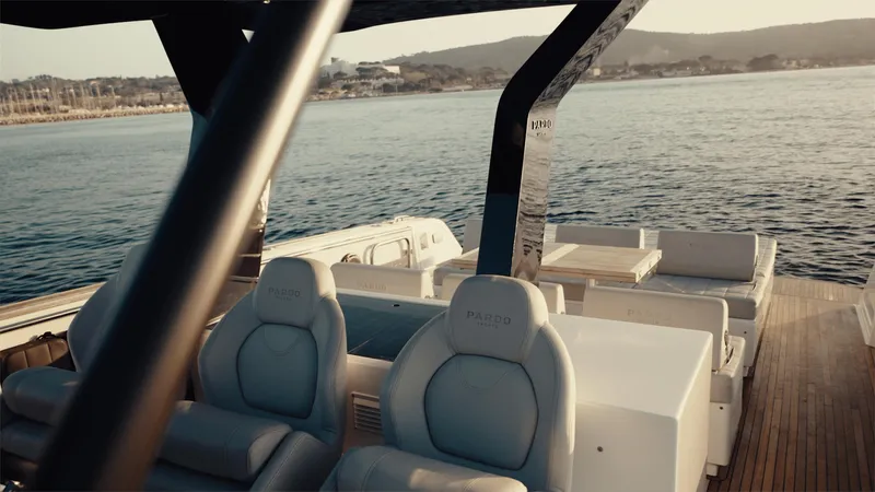 Mea Yacht Photos Pics Luxurious 2022 Pardo Yachts 43 on serene water, showcasing elegant seating and sleek design.