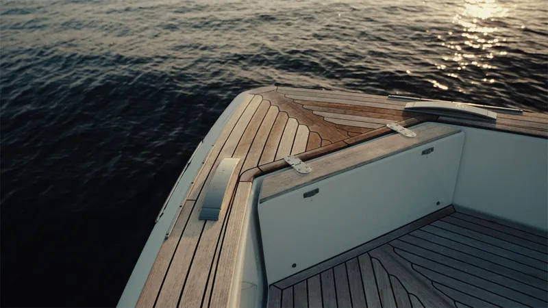 Mea Yacht Photos Pics Pardo Yachts 43 (2022) deck with elegant wood finish, overlooking calm water.