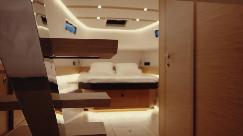 Mea Yacht Photos Pics Luxurious interior of 2022 Pardo Yachts 43, featuring a cozy bedroom with modern lighting.