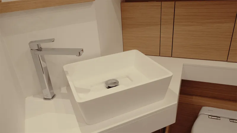 Mea Yacht Photos Pics Modern bathroom sink in 2022 Pardo Yachts 43, featuring sleek design and wood accents.