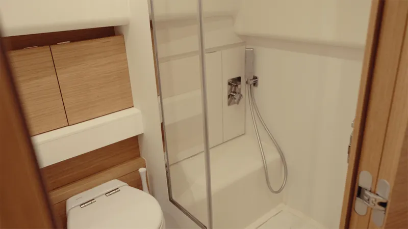 Mea Yacht Photos Pics Modern bathroom in 2022 Pardo Yachts 43, featuring sleek shower and wooden cabinetry.