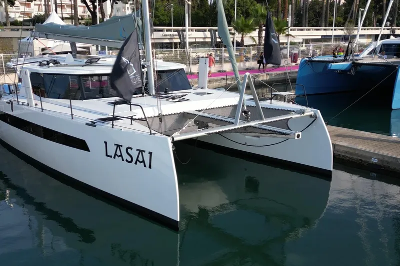 Lasai Yacht Photos Pics Modern Balance 442 catamaran named "Lasai" docked at a marina, 2023 model.