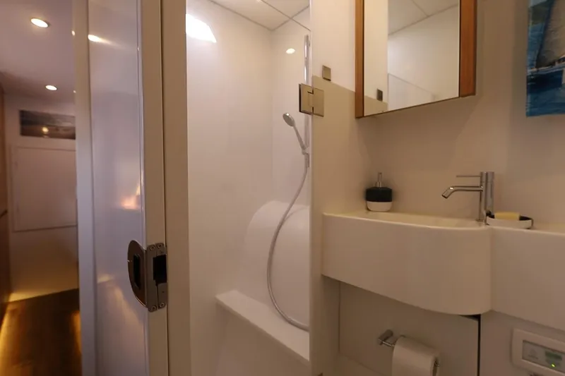 Lasai Yacht Photos Pics Modern bathroom interior in 2023 Balance 442 model yacht, featuring sleek fixtures and minimalist design.