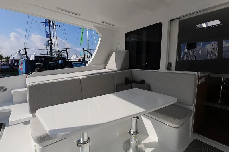 Lasai Yacht Photos Pics Modern Balance 442 yacht interior with sleek seating and table, 2023 model.