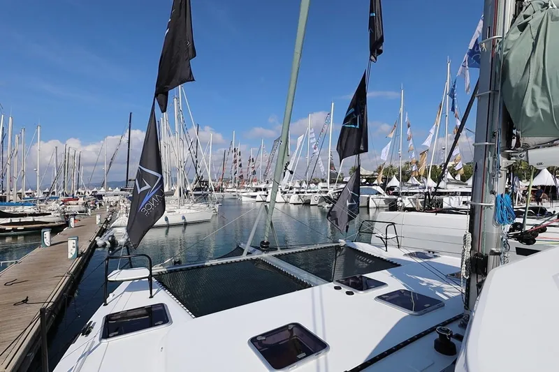 Lasai Yacht Photos Pics Sailboats docked at marina, featuring 2023 Balance 442 model under clear blue sky.