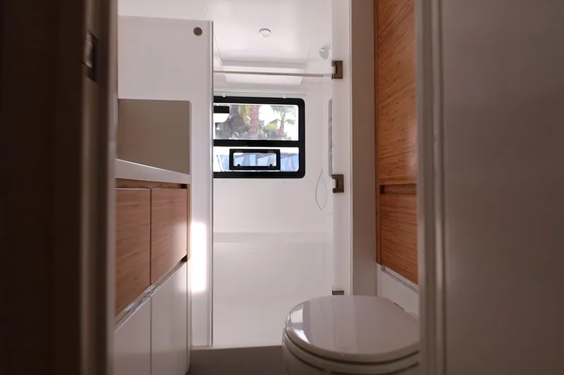 Lasai Yacht Photos Pics Modern bathroom interior in 2023 Balance 442 yacht, featuring sleek wood accents and natural light.
