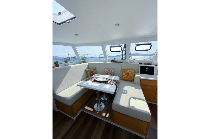 Lasai Yacht Photos Pics Luxurious interior of 2023 Balance 442 yacht with cozy seating and ocean view.
