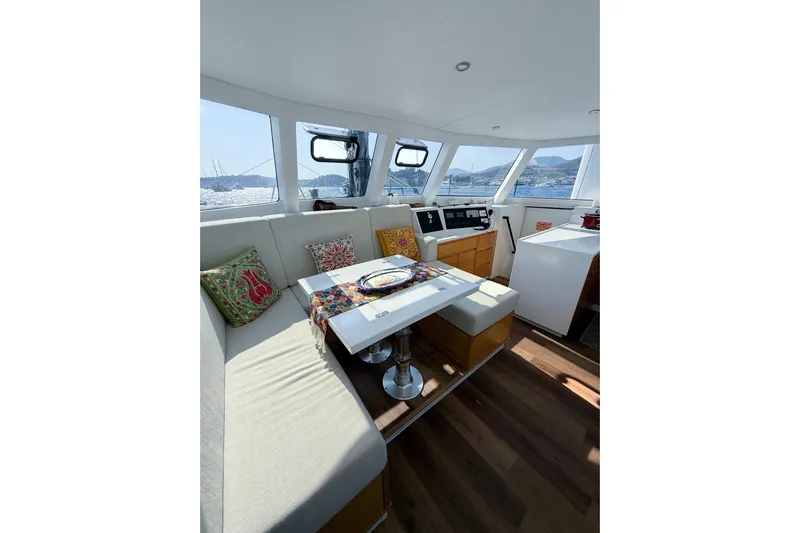 Lasai Yacht Photos Pics Luxurious interior of 2023 Balance 442 yacht with elegant seating and panoramic windows.