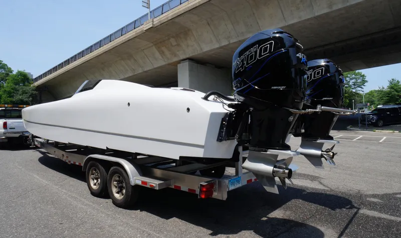  Yacht Photos Pics 2005 Doug Wright 32 powerboat on trailer with twin Mercury 400 outboard engines.