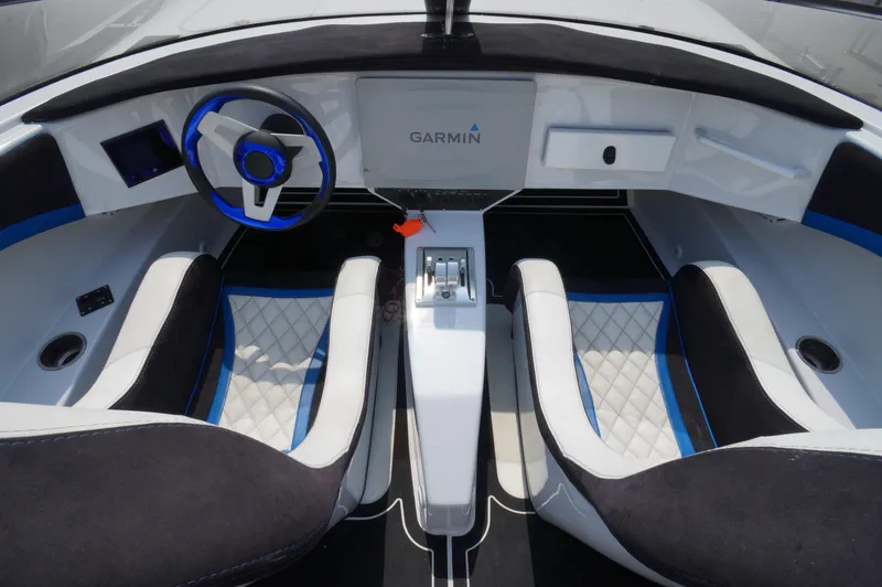  Yacht Photos Pics Interior of a 2005 Doug Wright 32 boat with modern steering and seating.