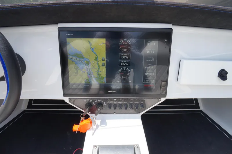  Yacht Photos Pics Garmin GPS display on Doug Wright 32 boat dashboard, showing navigation and fuel data.