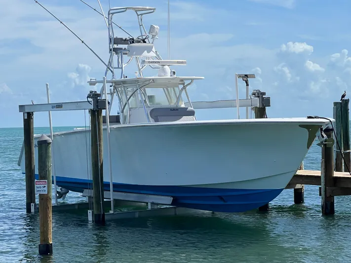  Yacht Photos Pics 2015 SeaHunter 41 Tournament boat docked on lift in sunny marina.