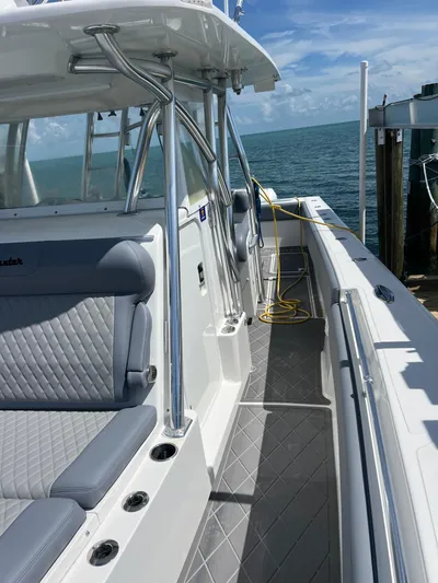  Yacht Photos Pics 2015 SeaHunter 41 Tournament boat docked, featuring sleek design and spacious seating.