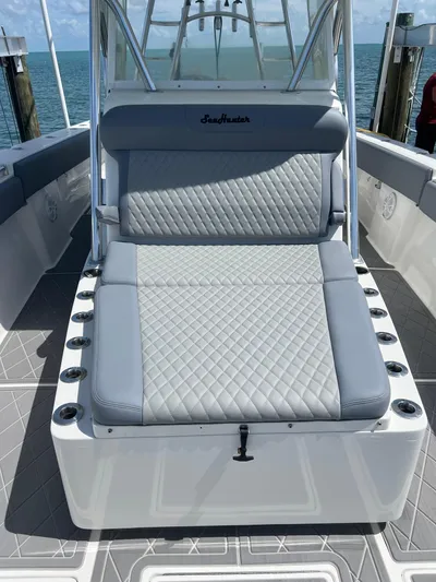  Yacht Photos Pics 2015 SeaHunter 41 Tournament boat with gray cushioned seating, docked by the ocean.