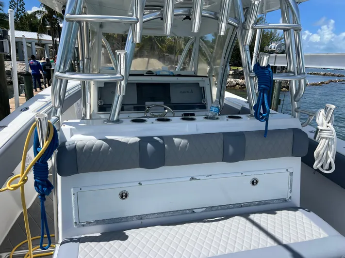  Yacht Photos Pics 2015 SeaHunter 41 Tournament boat with sleek console and rod holders, docked by the water.