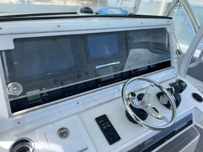  Yacht Photos Pics 2015 SeaHunter 41 Tournament helm with steering wheel and navigation displays.