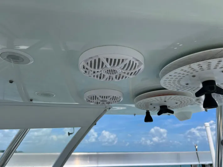  Yacht Photos Pics Ceiling speakers on 2015 SeaHunter 41 Tournament boat with blue sky background.