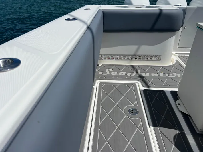  Yacht Photos Pics 2015 SeaHunter 41 Tournament boat deck with logo, featuring sleek design and ocean backdrop.
