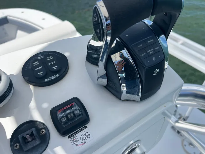  Yacht Photos Pics Control panel of a 2015 SeaHunter 41 Tournament boat with throttle and buttons.