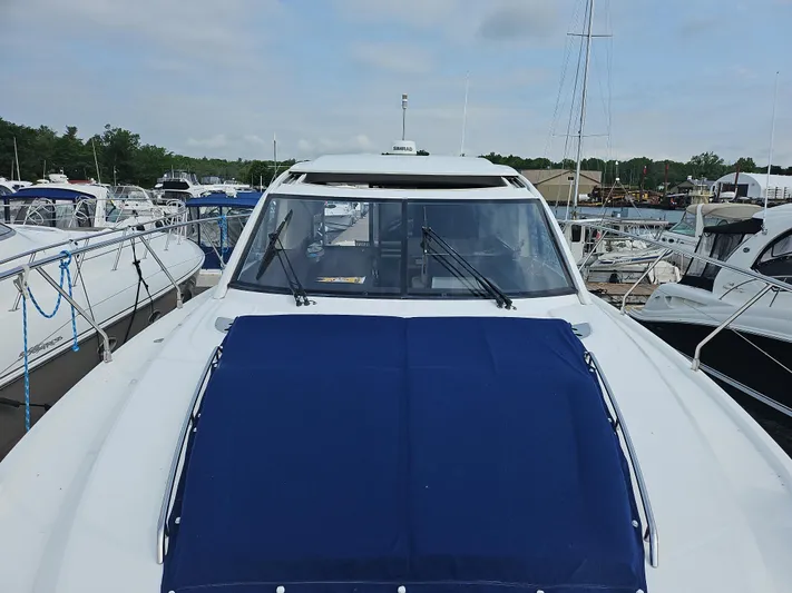 Yacht Photos Pics 2015 Beneteau GRAN TURISMO 49 yacht docked at marina, front view.